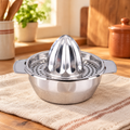 Bright Stainless Citrus Juicer hero: Bright Stainless Citrus Juicer: whole fitted reamer-and-bowl assembly