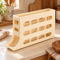 First Light Egg Dispenser hero: Whole creamy-yellow First Light egg dispenser with open top and lower dispensing cradle