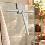 Glide Silicone Glass Squeegee story: Glide grey squeegee hanging from its matching hook beside shower glass