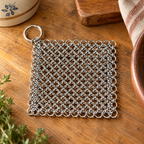 Hearth Chainmail Pan Cleaner detail: Silver interlinked rings and corner loop of Hearth