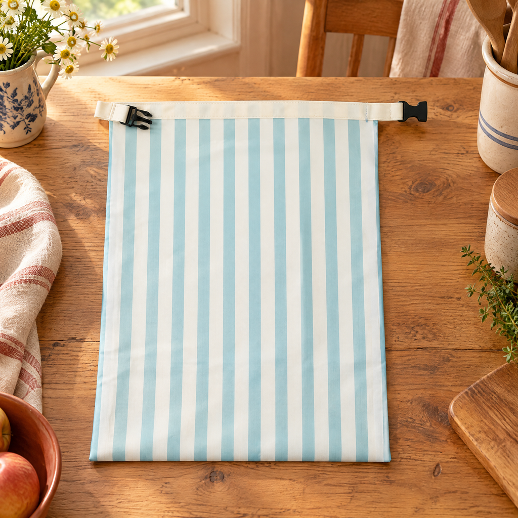 Loaf Striped Bread Bag hero: Complete Loaf blue-and-cream striped bag with cream buckle band
