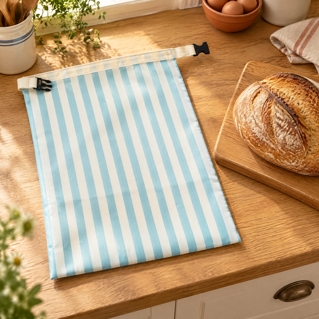 Loaf Striped Bread Bag story: Loaf bag beside a cooled bread loaf on a kitchen counter