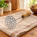 Mash Wooden-Handle Potato Masher hero: Mash wooden-handle perforated potato masher