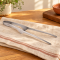Pass Stainless Serving Tong hero: Complete silver Pass serving tong with folded spring bow and two narrow tips