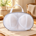 Petal Bra Wash Bag hero: Petal white twin-cup mesh bag with grey piping