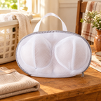 Petal Bra Wash Bag story: Petal shaped bag beside a laundry basket
