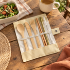 Pocket Bamboo Cutlery Set story: Pocket cutlery roll beside a packed lunch at an outdoor table