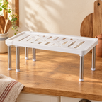 Second Shelf Cabinet Riser detail: Second Shelf showing its overlapping white top and adjustable width