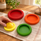 Stretch Four Produce Covers use: Hand gently adjusting one cover while the other three remain visible