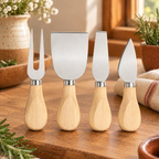 Supper Cheese Knife Set detail: Four distinct steel utensil heads and short rounded wooden handles
