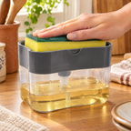 Washday Soap Station use: One hand pressing the yellow-green sponge down on Washday’s grey soap tray