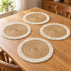 Woven Straw Placemat Set detail: Four Woven mats showing tan braided spiral texture and cream fringe